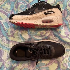 a pair of nike air maxes, size 8 in women